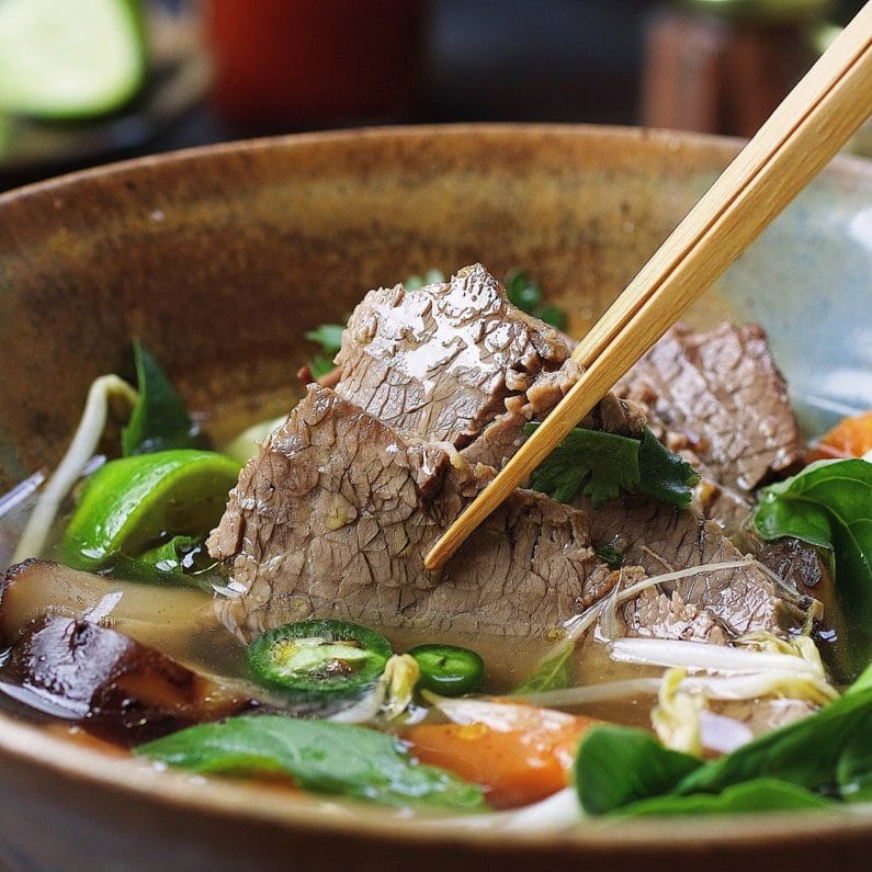 Paleo Beef Brisket Pho. Paleo beef pho instant pot recipe with tender brisket in light and aromatic broth. Perfect light supper that everyone in the family can enjoy ! IHeartUmami.com