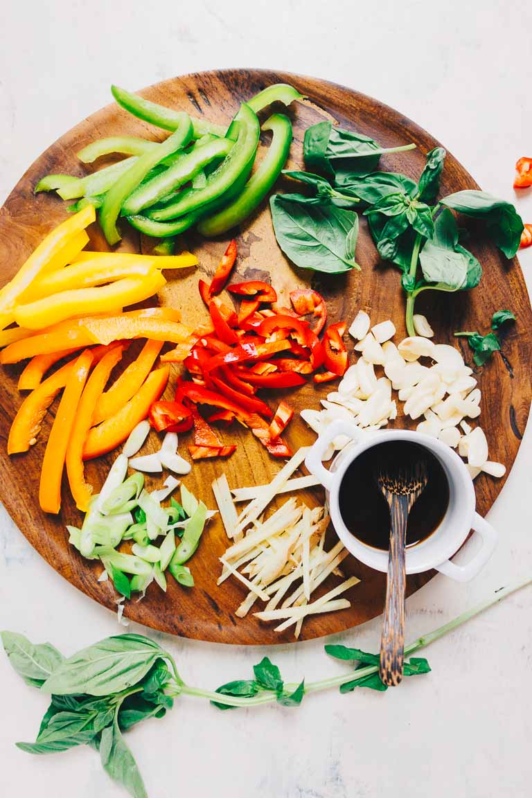 Thai basil and ingredients for pad krapow chopped and sauce prepared for stir-fry