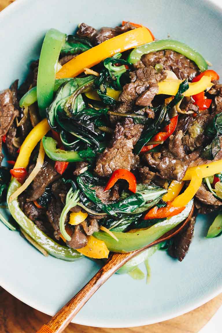 Thai basil beef (pad krapow) served in a big blue color bowl 