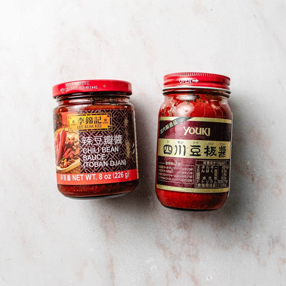 Photo shows 2 types of Doubanjiang - one regular and one gluten-free alternative.