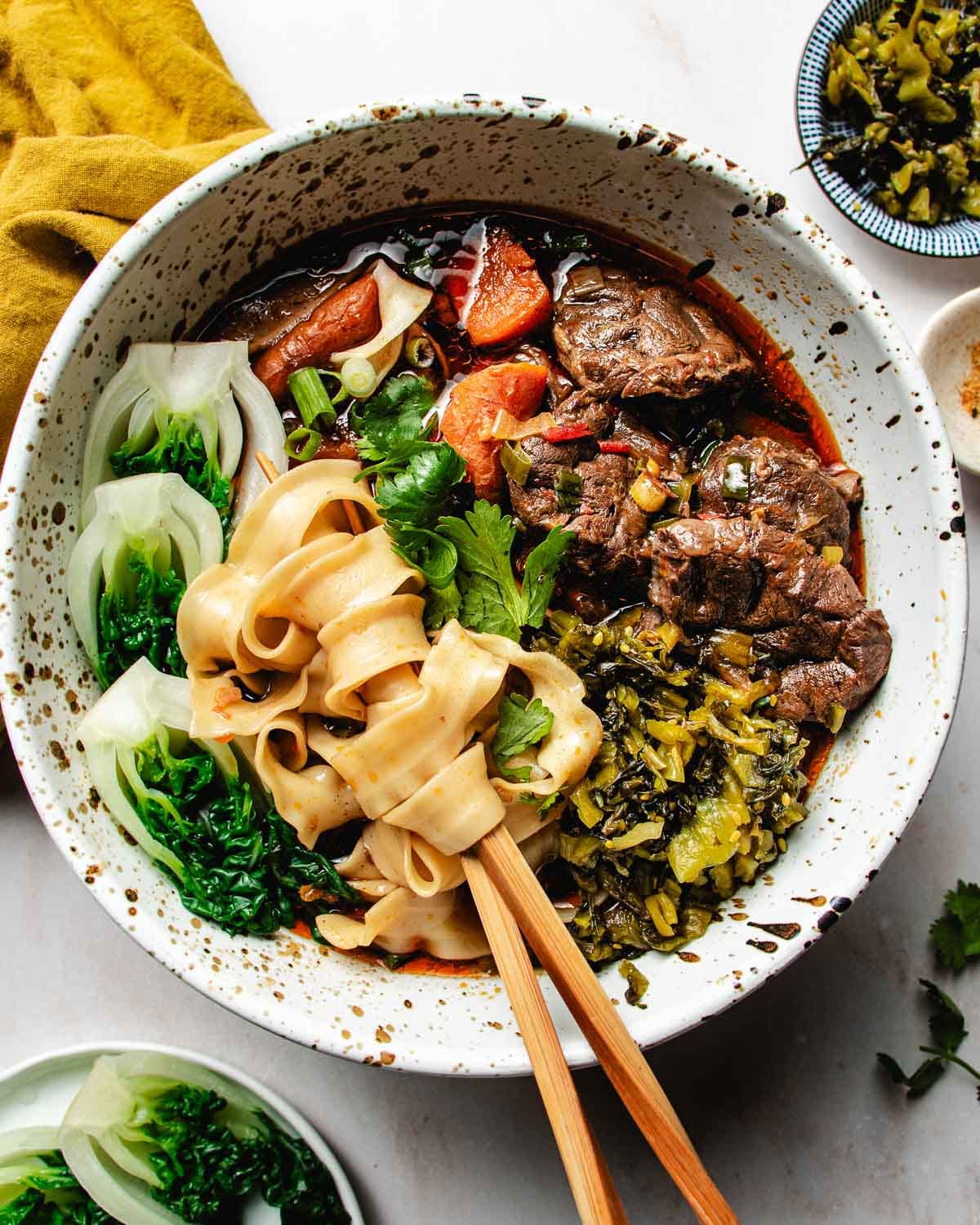 An overhead image shows how Taiwan beef noodle soup is served.