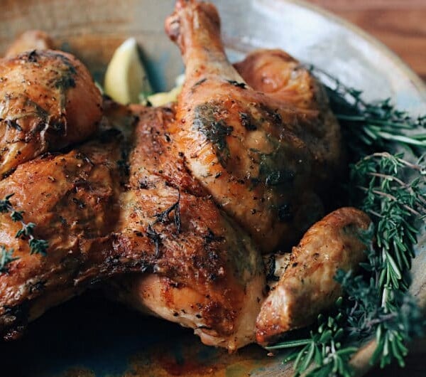 Simple Herb Roasted Spatchcock Chicken with rosemary, thyme, lemon, and garlic for Paleo Whole30 Keto holiday recipe.