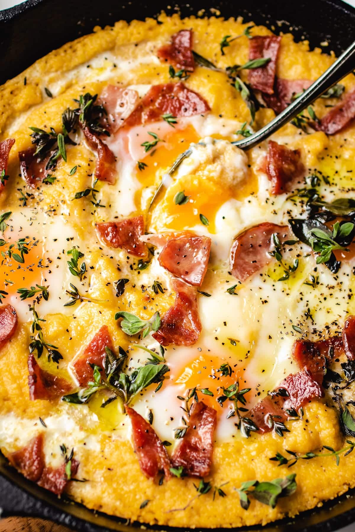 Baked breakfast grits in a cast iron skillet