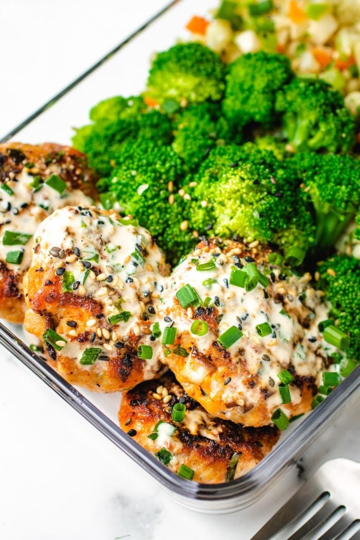 A lunch box version of the meatball sausage patties with broccoli and cauli rice