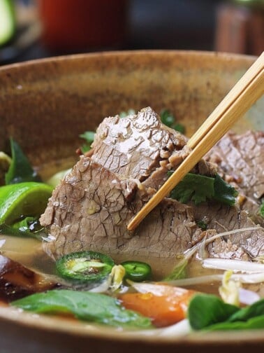 A recipe image shows cooked beef brisket to tender, sliced and served in Vietnamese pho broth