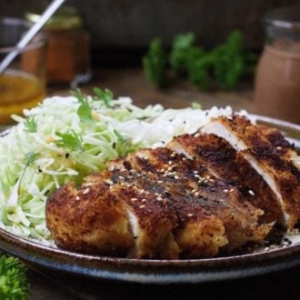 Paleo Chicken Katsu with thin shredded cabbage noodles in light Asian sesame ginger dressing. Paleo Whole30 chicken cutlets. Paleo Asain food. IHeartUmami.com