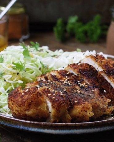 Paleo Chicken Katsu with thin shredded cabbage noodles in light Asian sesame ginger dressing. Paleo Whole30 chicken cutlets. Paleo Asain food. IHeartUmami.com