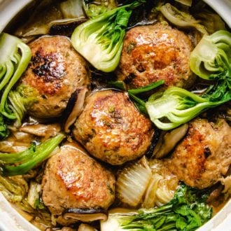 Photo shows jumbo meatballs and napa cabbage stew in a big white clay pot