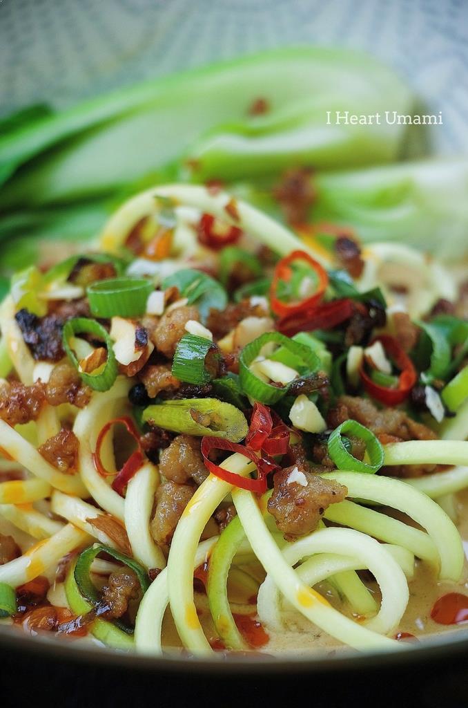 Easy and low carb Paleo Dan Dan Zucchini Noodles recipe with crispy crumble pork and bok choy vegetable in creamy sesame noodle dressing.