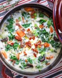 Feature image shows creamy chicken with kale and bacon crumbles in creamy chicken broth in a Dutch oven.