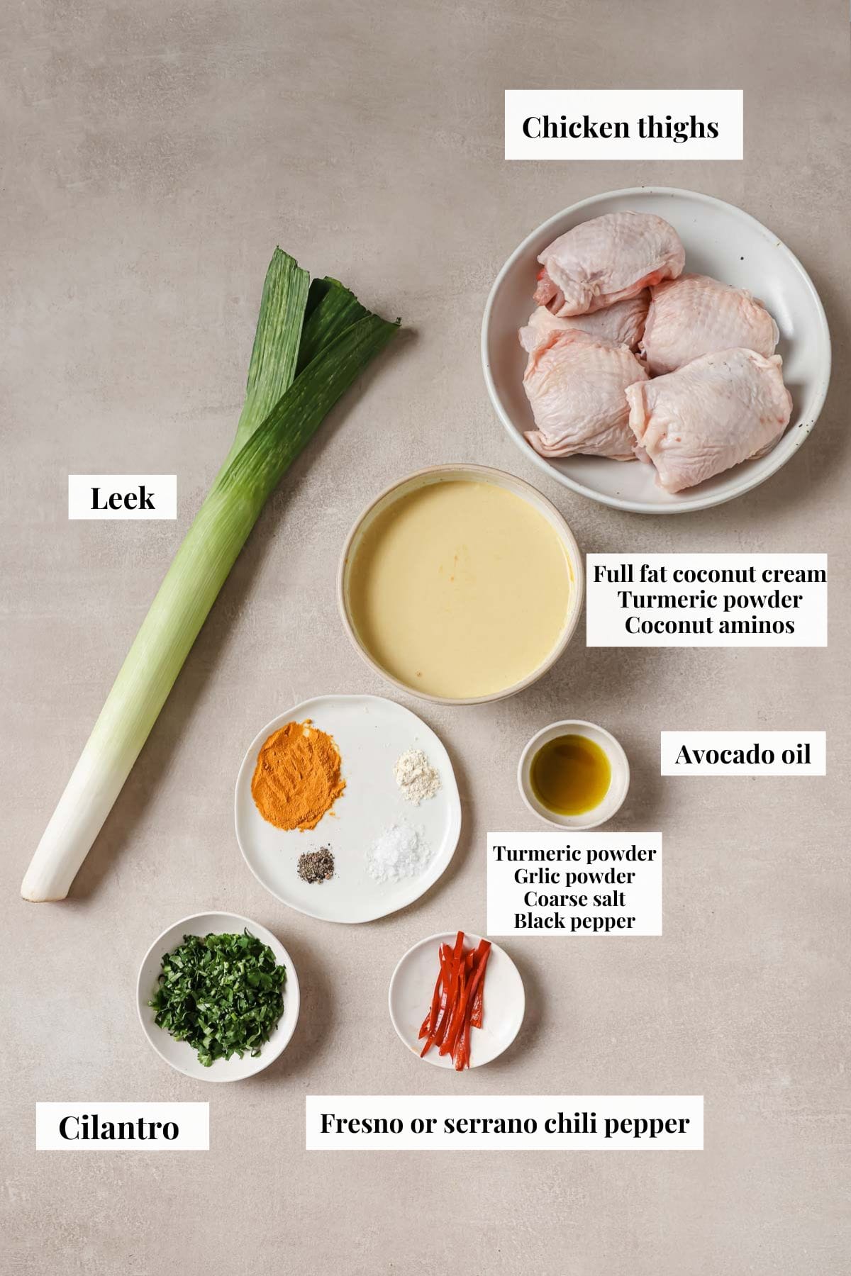 Photo shows ingredients needed to make recipe with chicken and leeks.