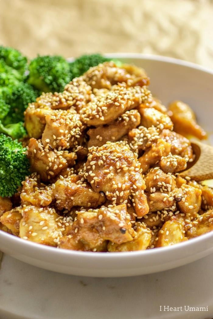 Healthy chicken recipe with sesame sauce served with broccoli on the side. 