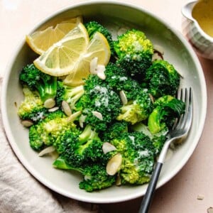 Recipe image shows broccoli florets tossed with garlic butter sauce served in a plate.