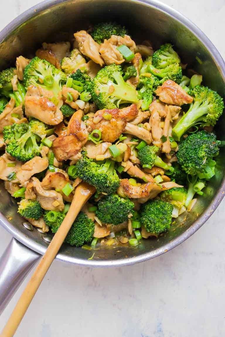 A big skillet filled with chicken and vegetables for a healthy meal!