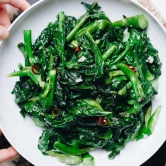 Easy Chinese Broccoli stir fry (kai lan) with garlicky sauce is a Vegan, Paleo, Whole30, Keto, and low carb recipe.