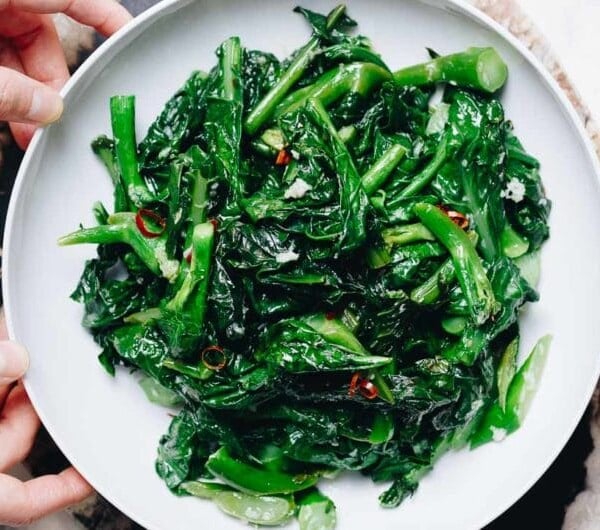 Easy Chinese Broccoli stir fry (kai lan) with garlicky sauce is a Vegan, Paleo, Whole30, Keto, and low carb recipe.