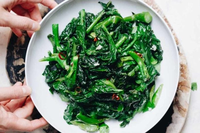 Easy Chinese Broccoli stir fry (kai lan) with garlicky sauce is a Vegan, Paleo, Whole30, Keto, and low carb recipe.