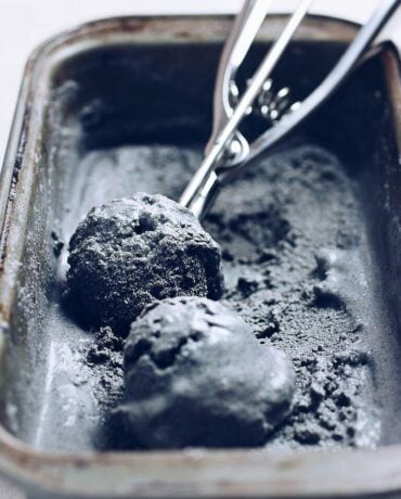Photo shows homemade black sesame ice cream served in a chilled container