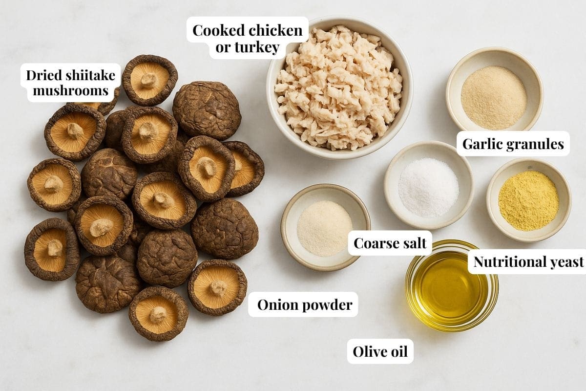 A top view of ingredients in bowls: cooked chicken or turkey, dried shiitake mushrooms, onion powder, coarse salt, olive oil, garlic granules, nutritional yeast, and healthy chicken bouillon—each labeled with text.