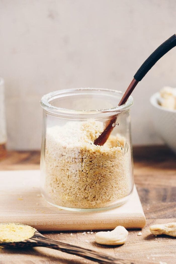 Dairy-Free Paleo Parmesan Cheese made with cashew and nutritional yeast for non dairy substitute parmesan cheese.