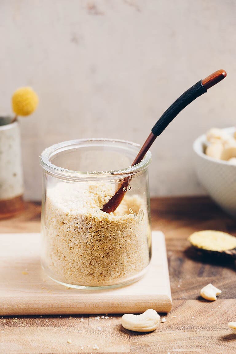 Dairy-Free Paleo Parmesan Cheese made with cashew and nutritional yeast for non dairy substitute parmesan cheese.