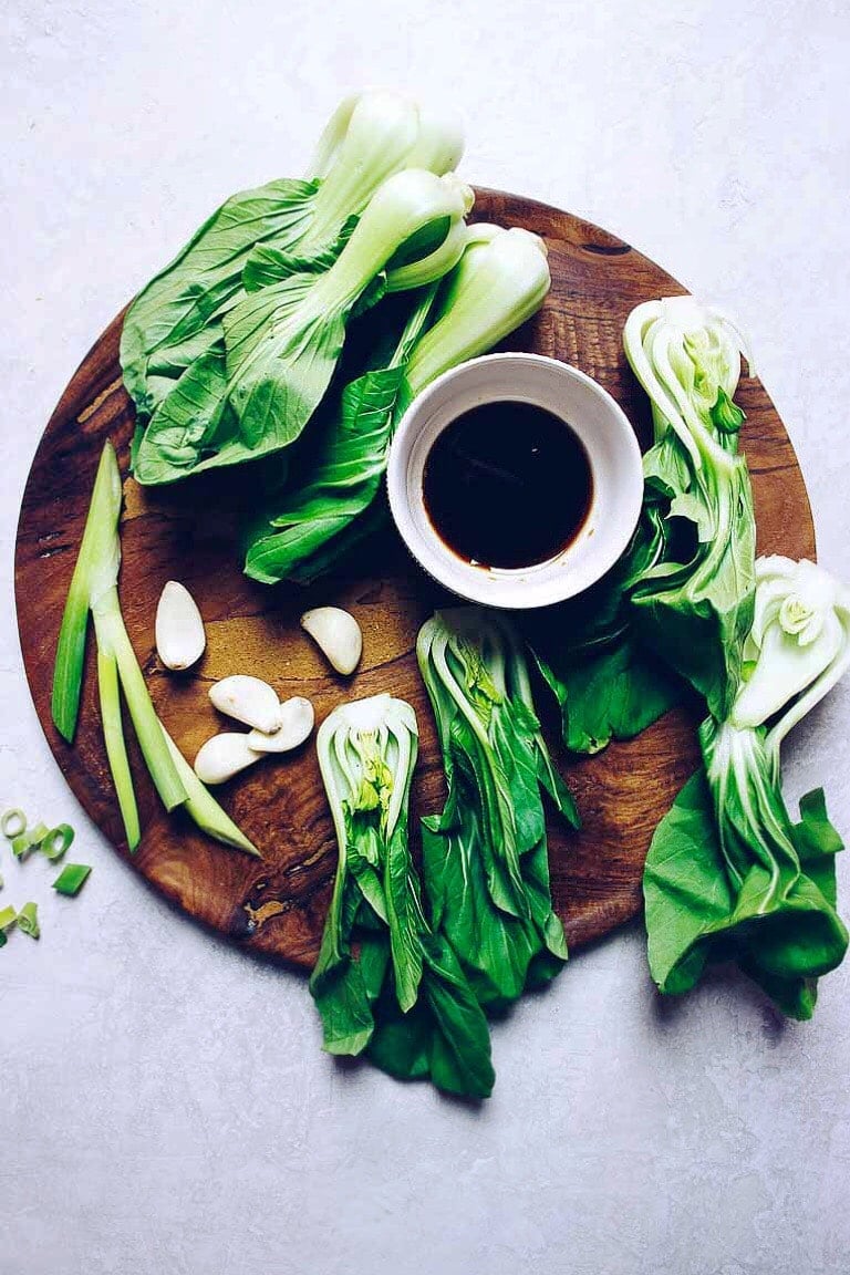 Photo shows ingredients needed to make this dish - diced and chopped over a chopping board. 