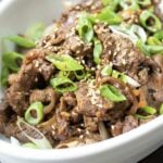 A recipe photo shows tenderized beef stir-fried and garnish with chopped scallions