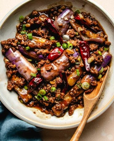 Photo shows Yuxiang Chinese eggplant stir fried with garlic sauce served on a white plate