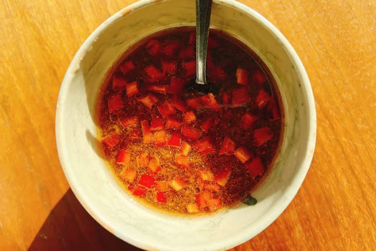 Photo shows a bowl of emulsified creamy Thai chili lime dressing.