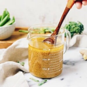 Creamy and tart Paleo Creamy Ginger Salad Dressing recipe is Paleo, Whole30, Keto, and Vegan from I Heart Umami.