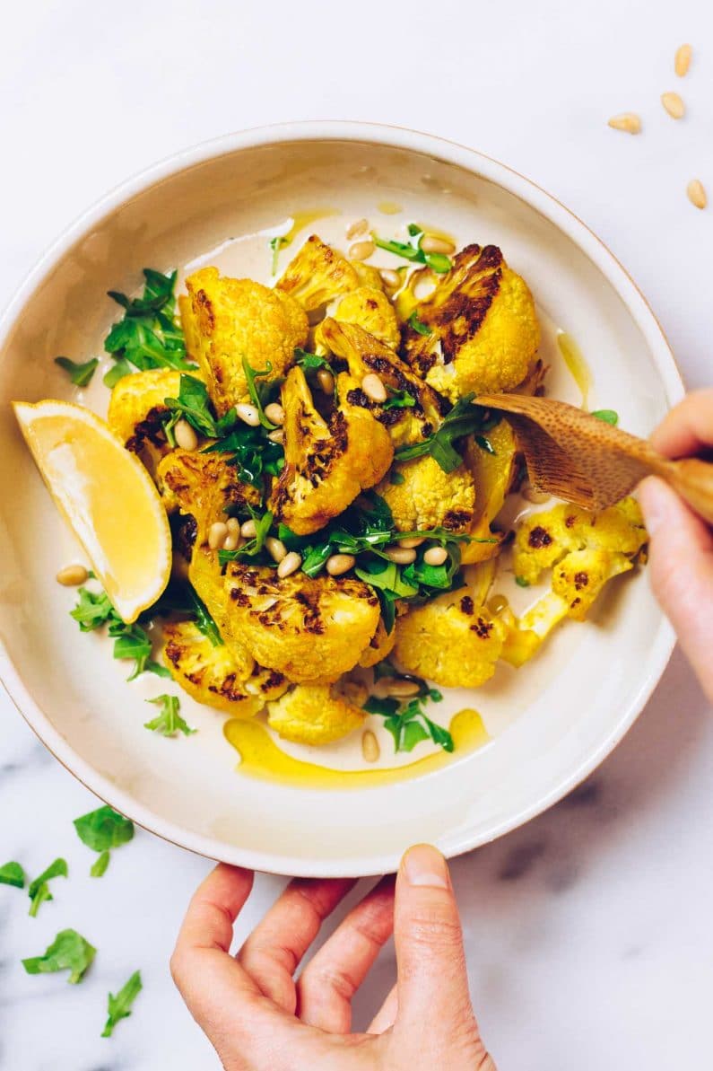 Paleo Roasted Cauliflower Recipe with tahini-lemon sauce from I Heart Umami.