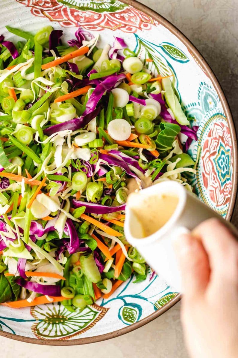 Paleo Asian Coleslaw tossed in a creamy Whole30 sesame dressing