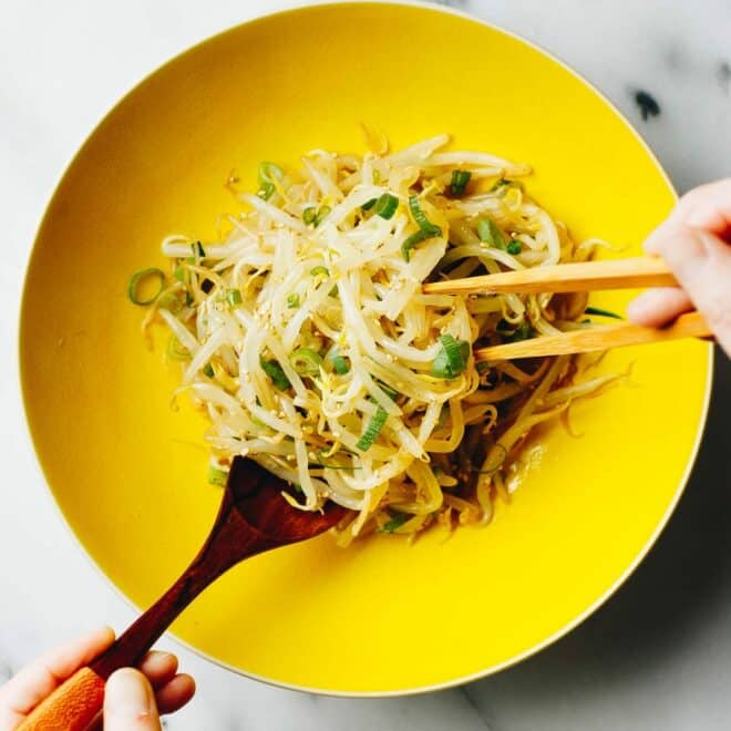 Korean bean sprout salad recipe served in a yellow color bowl