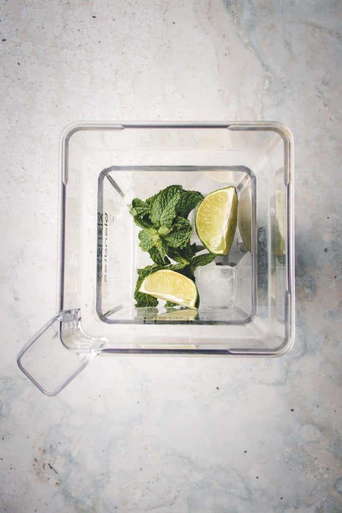 Mint, lime, and crushed ice for fruit salad