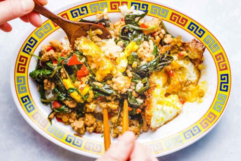 Pad Krapow Gai Spicy mixed with eggs and rice
