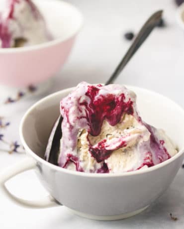 A dairy-free/no churn Lavender Honey Ice Cream recipe with blueberry-lavender syrup is paleo and keto friendly.