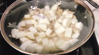 Add daikon with stock to simmer