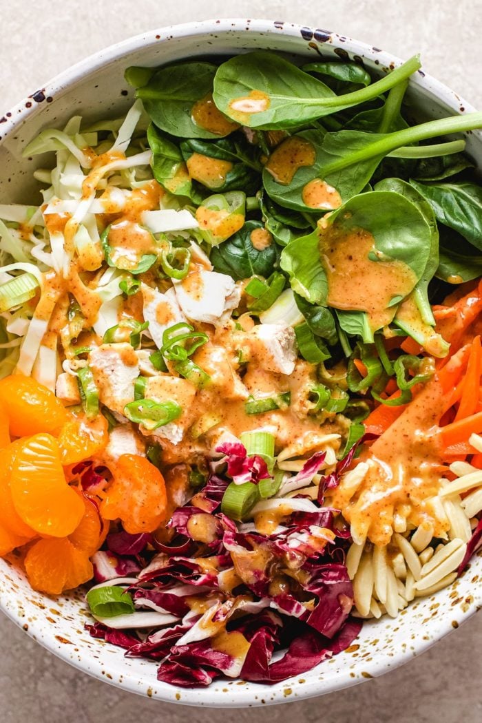 A close shot showing ingredients inside of Mandarin chicken salad bowl