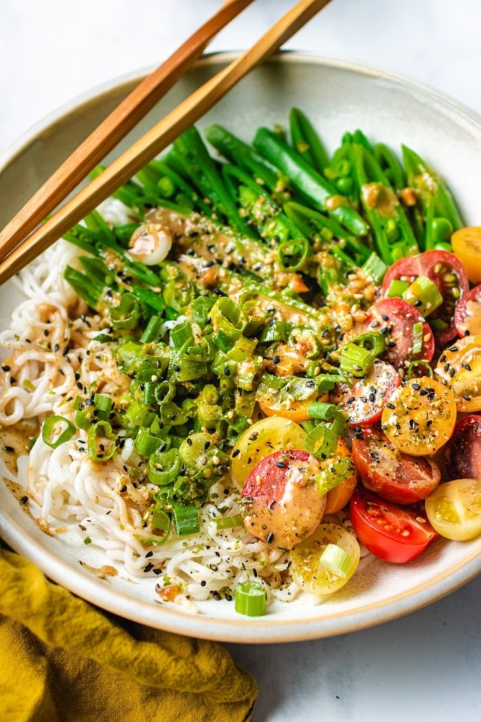 shirataki konjac noodles tagliatelle in a bowl, with chopsticks