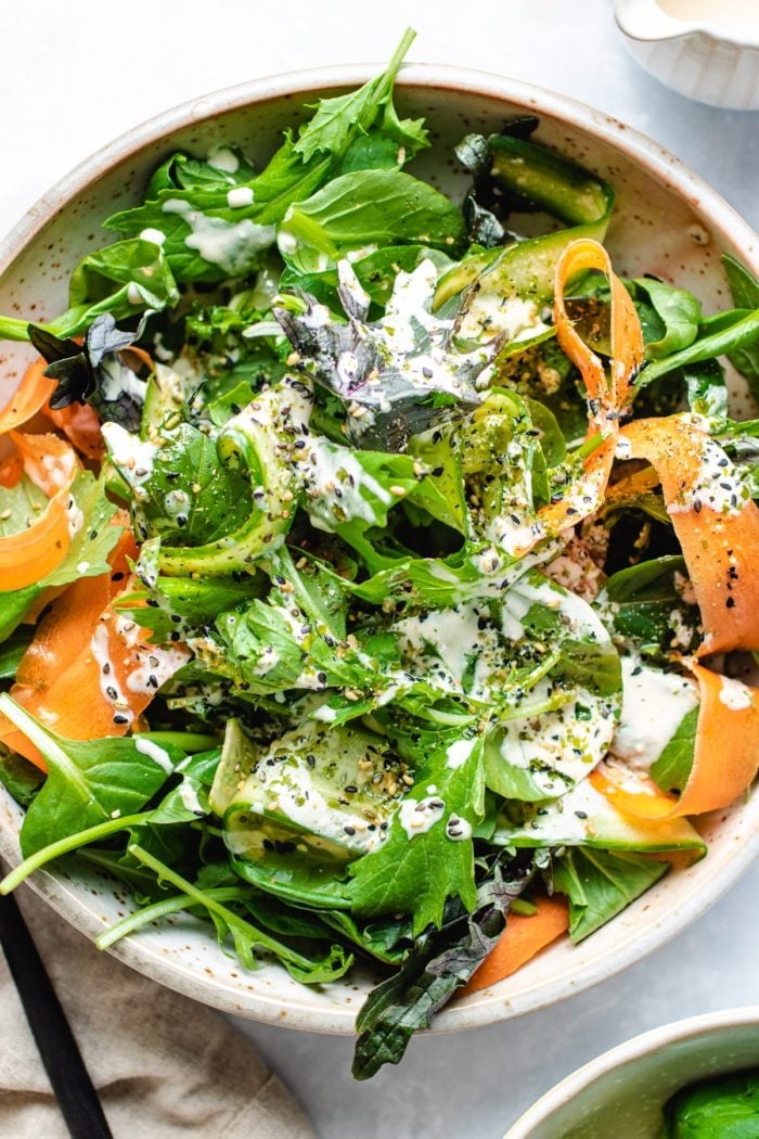 Asian Green Tatsoi salad with carrots and cucumber in ranch yogurt dressing