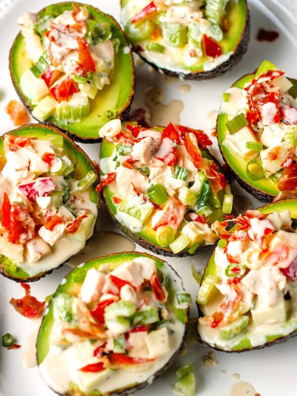 Stuffed avocados with chicken and apples over a large plate