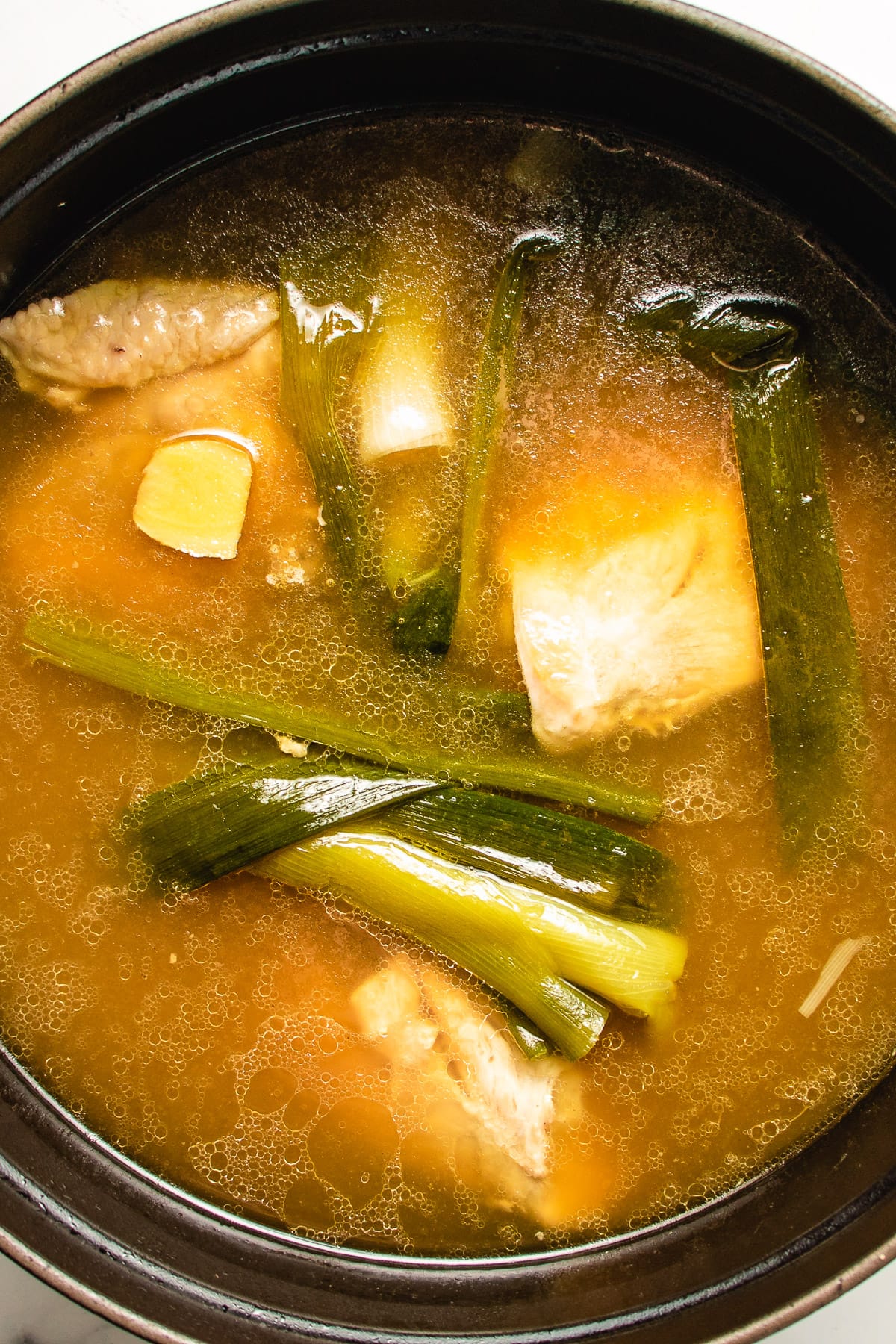 A photo shows the chicken broth made from scratch for low carb egg drop soup use.