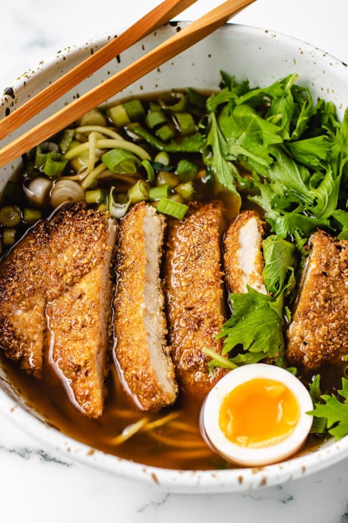 A close shot of ramen bowl with chicken katsu