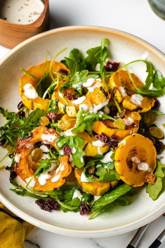 Another plate shows baked squash delicata recipe