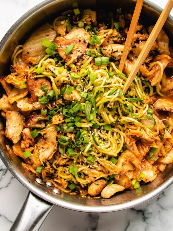 Kimchi and Chicken Stir-Fry with Zucchini Noodles in a large skillet.