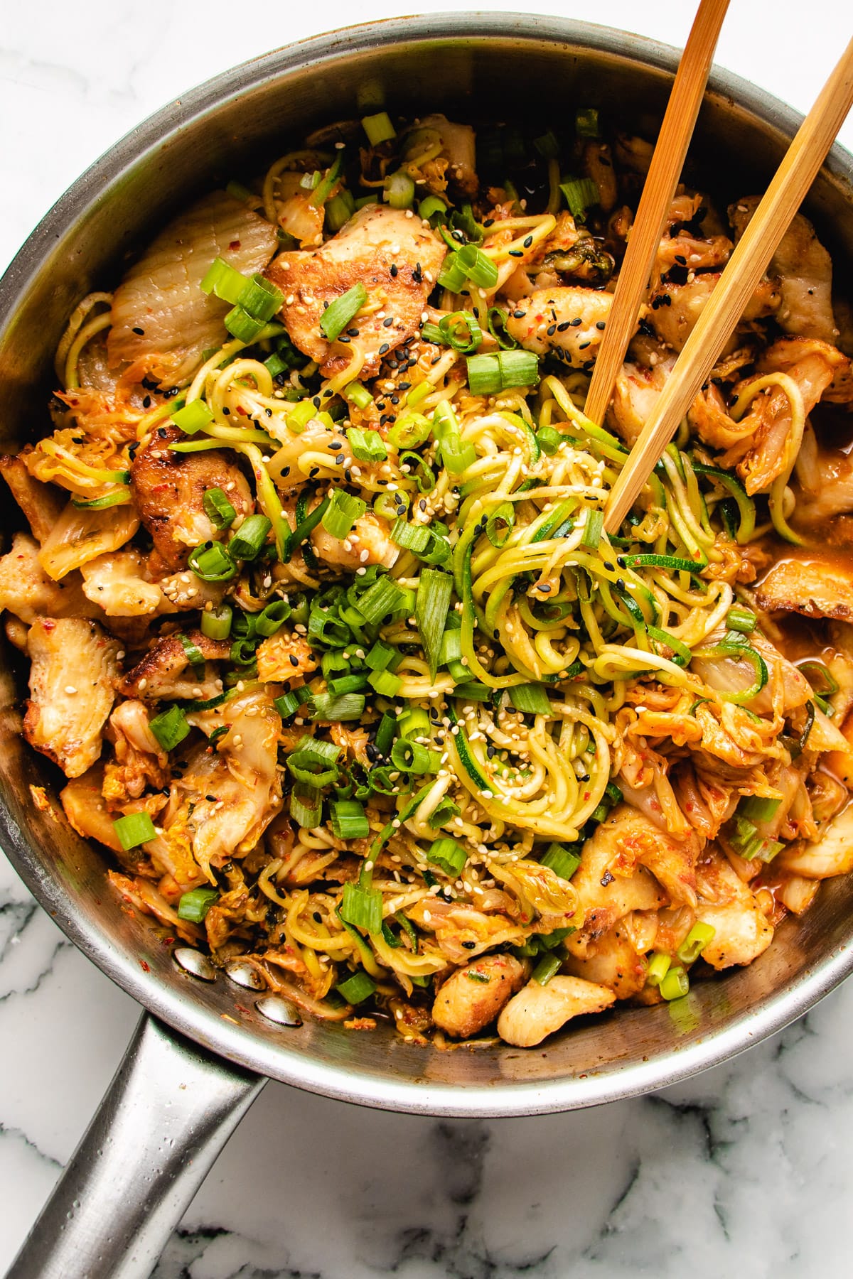 Kimchi and Chicken Stir-Fry with Zucchini Noodles in a large skillet.