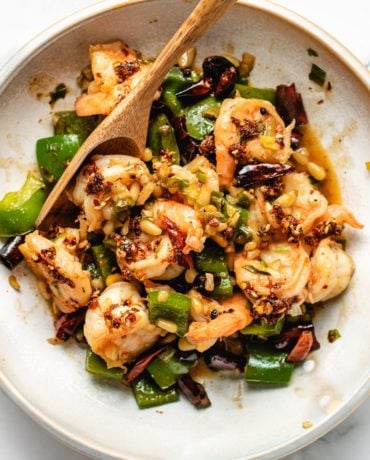 A feather photo shows the shrimp kung pao dish