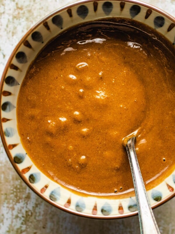 Photo shows a bowl of creamy gluten free hoisin sauce blended to perfect consistency in a beautiful bowl.