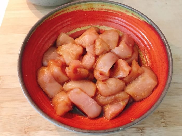 Dice the chicken to cubes and add the seasoning