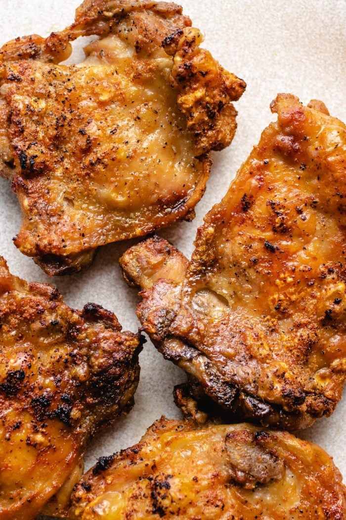 A close shot photo shows the crispy chicken skin from air fryer